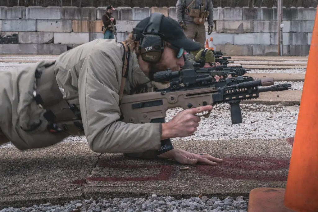 IWI-TAVOR-OPERATOR-1---PRONE A man with a rifle on the ground